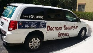 A white van with the words doctors transport service on it.